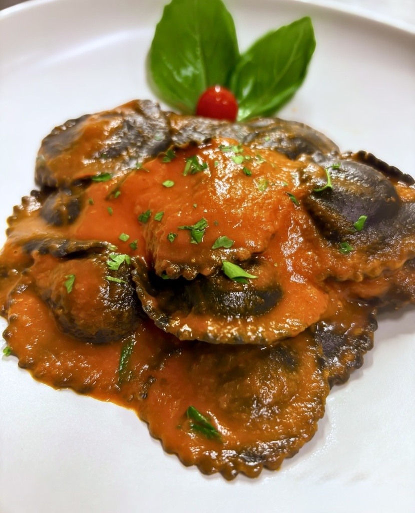 Agnolotto al Nero di seppia, ripieni di Branzino